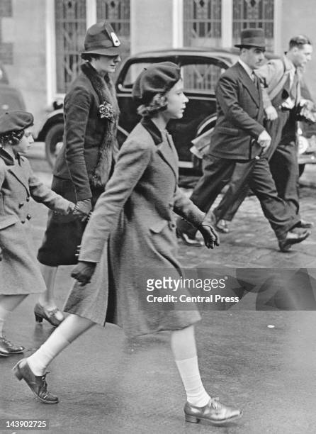Royal governess Marion Crawford accompanies Princesses Elizabeth and Margaret to the headquarters of the YWCA , off Tottenham Court Road, London,...