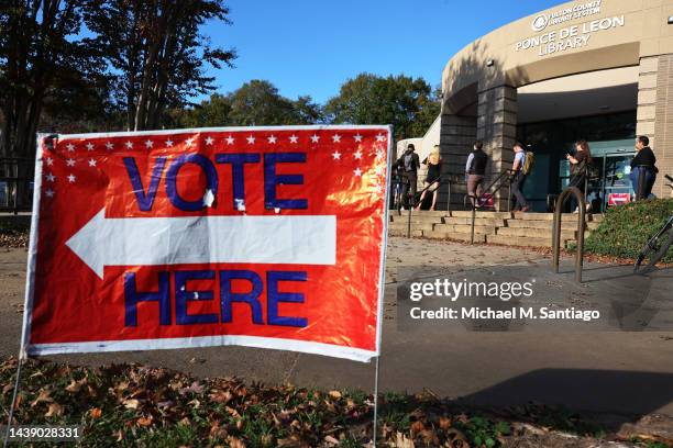 People wait in line for early voting for the midterm elections at Ponce De Leon Library on November 04, 2022 in Atlanta, Georgia. Long lines were...