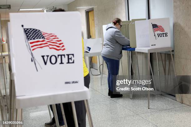 Residents cast their ballots during in-person absentee voting at City Hall on November 04, 2022 in Green Bay, Wisconsin. Residents will be able to...