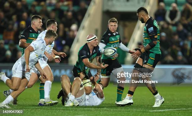 Aaron Hinkley of Northampton Saints off loads the ball during the Gallagher Premiership Rugby match between Northampton Saints and Exeter Chiefs at...