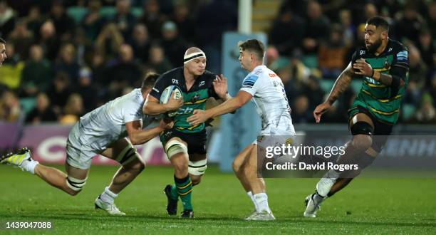 Aaron Hinkley of Northampton Saints is tackled by Jack Maunder during the Gallagher Premiership Rugby match between Northampton Saints and Exeter...