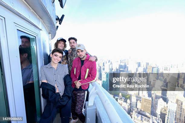 Trevor Dahl, KEVI, and Matthew Russell of Cheat Codes; and Dixie D'Amelio visit The Empire State Building on November 04, 2022 in New York City.