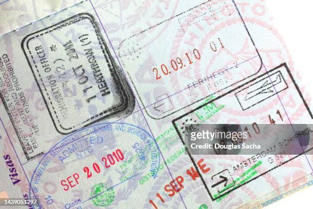 stamp on united states travelers passport - passports stock pictures, royalty-free photos & images