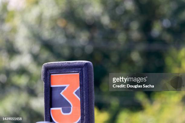down marker sign on a football game field - distance marker stock pictures, royalty-free photos & images