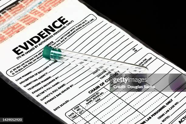 test tube for dna samples on the crime scene - beweismittel stock-fotos und bilder