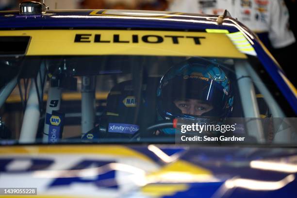 Chase Elliott, driver of the NAPA Auto Parts Chevrolet, sits in his car in the garage area during practice for the NASCAR Cup Series Championship at...