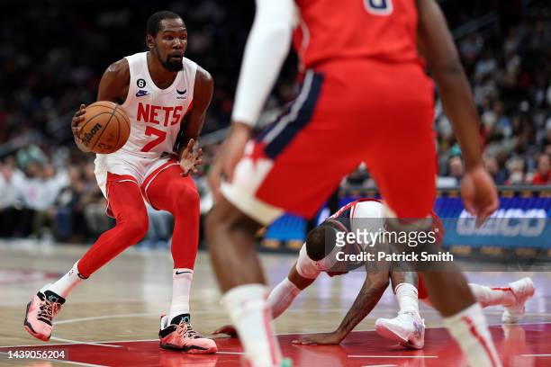 Kevin Durant of the Brooklyn Nets crosses up Daniel Gafford of the Washington Wizards during the first half at Capital One Arena on November 4, 2022...