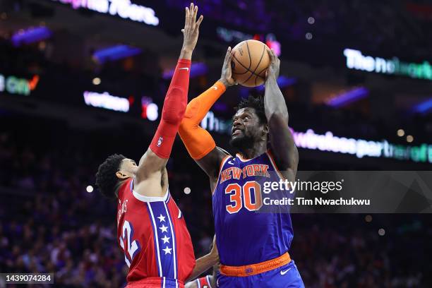 Julius Randle of the New York Knicks elevates past Tobias Harris of the Philadelphia 76ers during the third quarter at Wells Fargo Center on November...