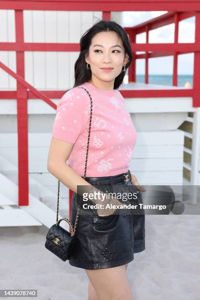 Arden Cho attends CHANEL Cruise 2022/23 Collection in Miami at Faena Beach on November 04, 2022 in Miami Beach, Florida.