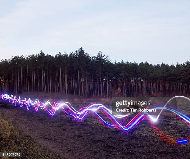 red, blue and white light trails on heath. - track and field photos et images de collection