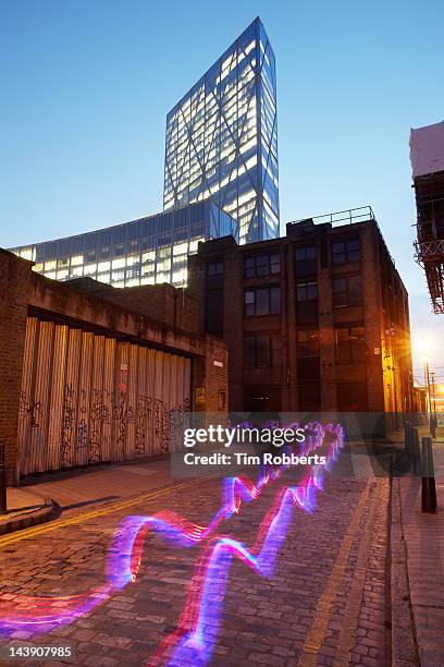 light trail in city. - blurred running sunset stock-fotos und bilder