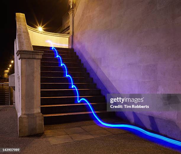 light trail on steps. - moving lights stock pictures, royalty-free photos & images