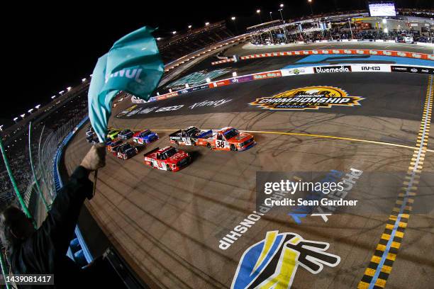 Zane Smith, driver of the Michael Roberts Construction Ford, leads the field to the green flag to start the NASCAR Camping World Truck Series Lucas...