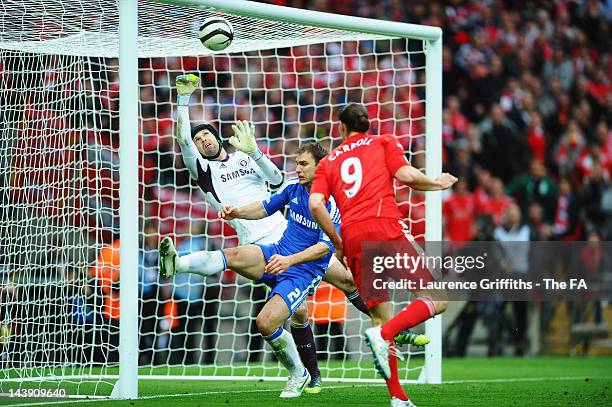 Andy Carroll of Liverpool heads the ball and Petr Cech of Chelsea pushes it onto the cross bar during the FA Cup Final with Budweiser between...