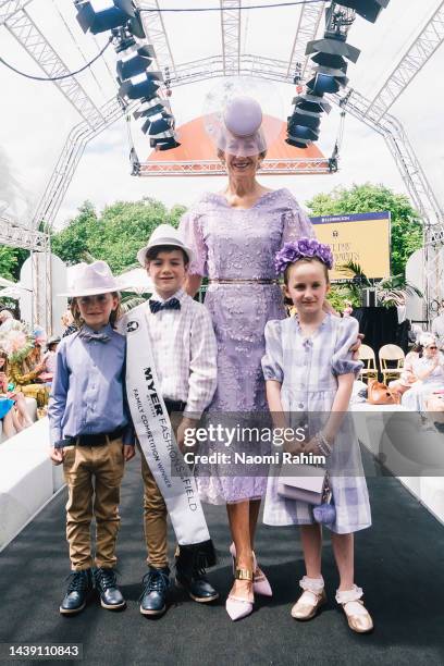 Fashions on the Field Family competition winner Jenny Beard and her grand children Alby, George and Nellie pose on the runway during 2022 TAB...