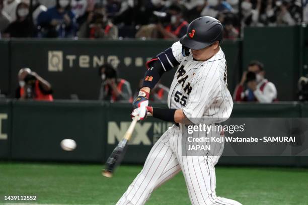 Designated hitter Munetaka Murakami of Samurai Japan hits a solo home run in the sixth inning during the game between Samurai Japan and Hokkaido...