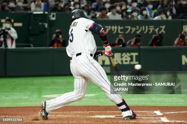 Designated hitter Munetaka Murakami of Samurai Japan hits a solo home run in the sixth inning during the game between Samurai Japan and Hokkaido...