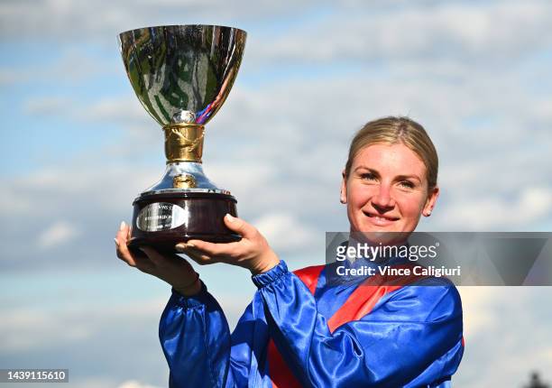 Jamie Kah poses with the champions trophy after riding Zaaki to win Race 8, the Tab Champions Stakes, during 2022 TAB Champions Stakes Day at...