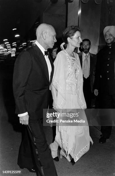 Yul Brynner and Jacqueline de Croisset attend a party at Raga's in New York City on May 2, 1977.