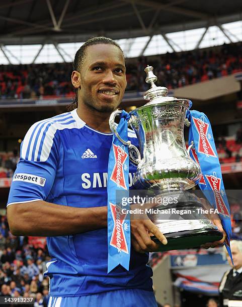 Didier Drogba of Chelsea celebrates victory with the trophy in the FA Cup Final with Budweiser between Liverpool and Chelsea at Wembley Stadium on...