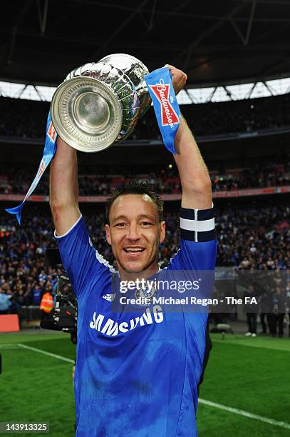 John Terry of Chelsea celebrates victory with the trophy in the FA Cup Final with Budweiser between Liverpool and Chelsea at Wembley Stadium on May...