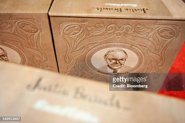 An image of Warren Buffett, chairman of Berkshire Hathaway Inc., is seen on a shoebox on display in the Justin Boots booth during the Berkshire...