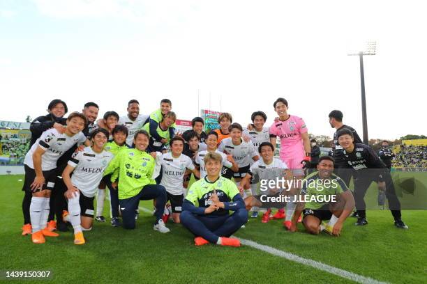Shonan Bellmare players players celebrate their victory after pose for photograph during the J.LEAGUE Meiji Yasuda J1 34th Sec. Match between Kashiwa...