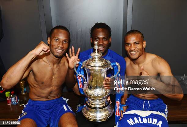 Didier Drogba, Michael Essien and FLorent Malouda of Chelsea celebrate with the trophy in the changing room after the FA Cup Final with Budweiser...