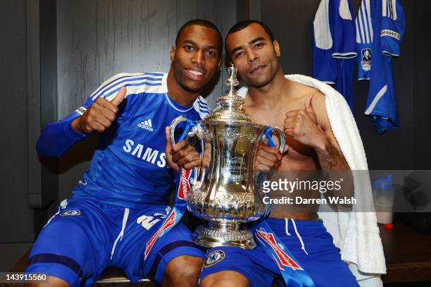 Daniel Sturridge and Ashley Cole of Chelsea celebrate with the trophy in the changing room after the FA Cup Final with Budweiser between Liverpool...