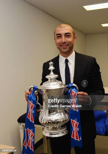 Roberto Di Matteo of Chelsea celebrates with the trophy in the dressing room after the FA Cup Final with Budweiser between Liverpool and Chelsea at...