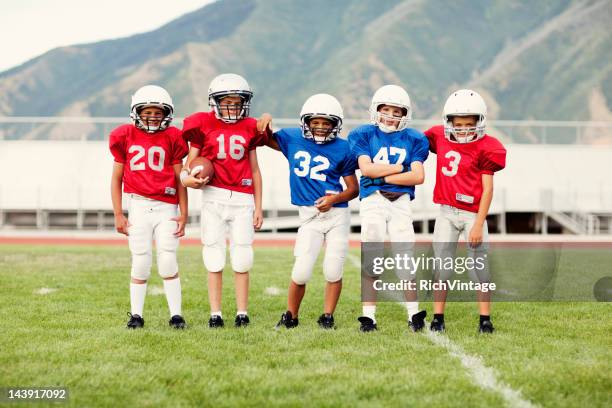 sportsmanship - youth football team stock pictures, royalty-free photos & images