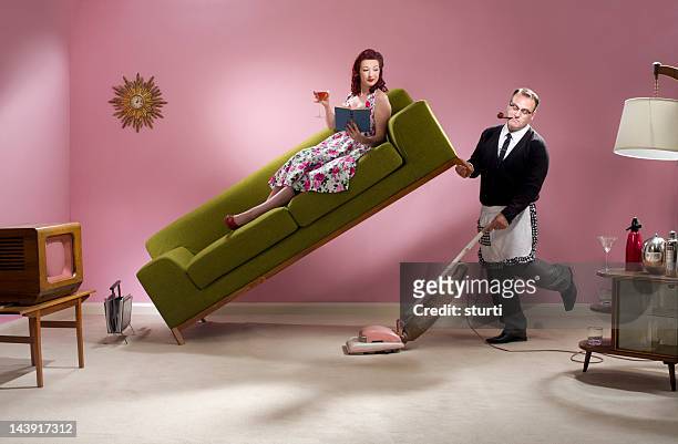 man about the house - housework humour stock pictures, royalty-free photos & images
