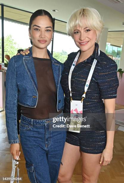 Shanina Shaik and Pixie Lott pose in the evian VIP Suite on day one of Wimbledon 2023 on July 3, 2023 in London, England.