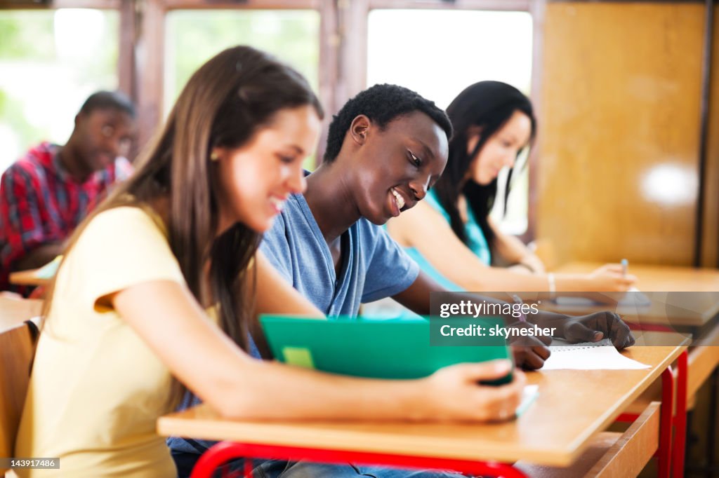 Student Using Notebook Paper Students Writing In Their Notebooks High-Res Stock Photo - Getty Images