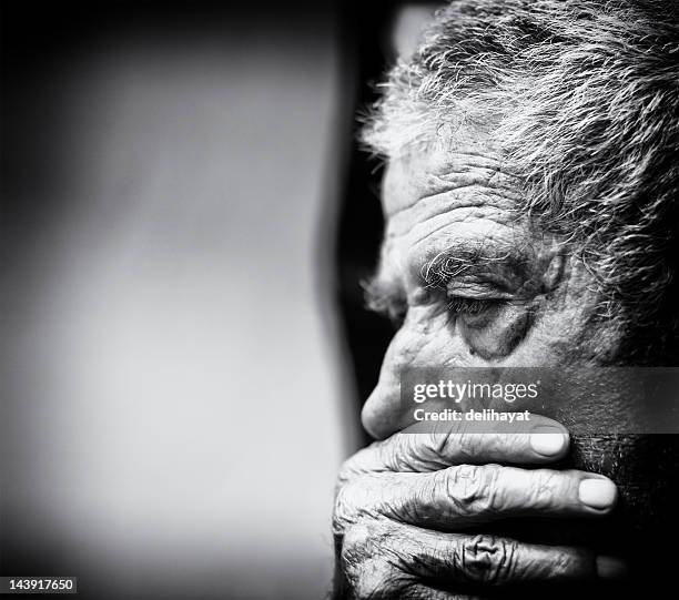 a black and white close-up of a senior man - black and white hands stock pictures, royalty-free photos & images