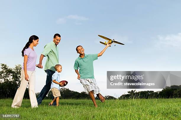 family in park - indian football stock pictures, royalty-free photos & images