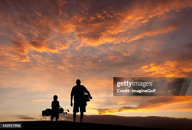 father and son golf silhouette - father son golf stock pictures, royalty-free photos & images