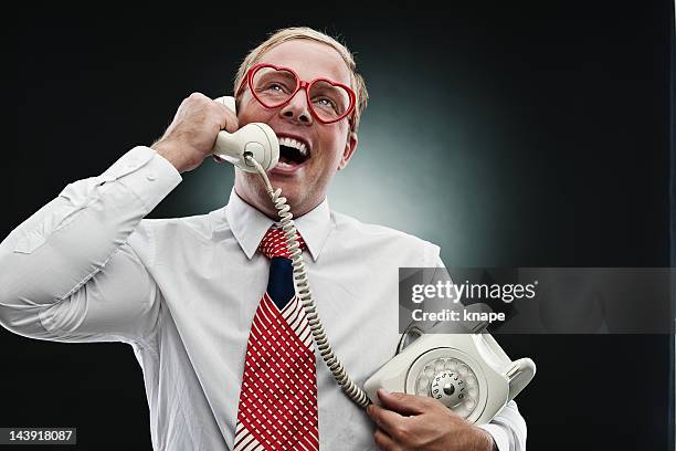 funny man in heartshaped glasses - plastic nerd glasses stock pictures, royalty-free photos & images