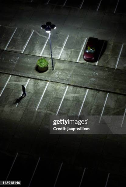 parking lot at night - car theft stock pictures, royalty-free photos & images