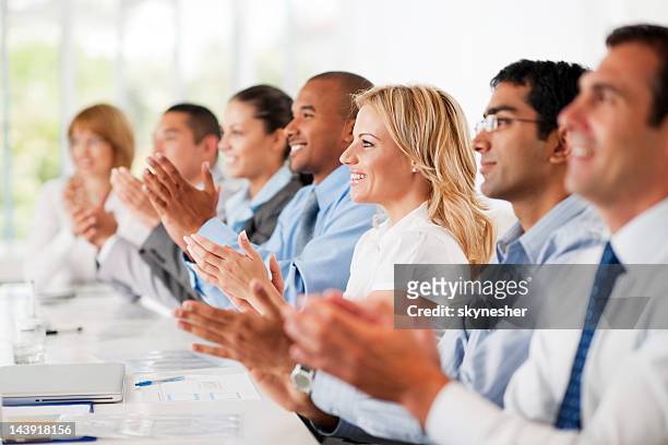 business group clapping. - applause stock pictures, royalty-free photos & images