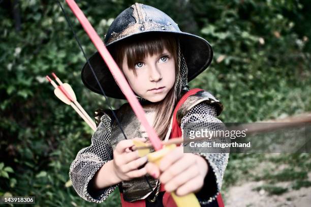 little archer im wald - man acting being shot stock-fotos und bilder