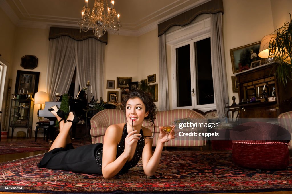 Sophisticated Girl Holding A Glass Of Martini.Color Image