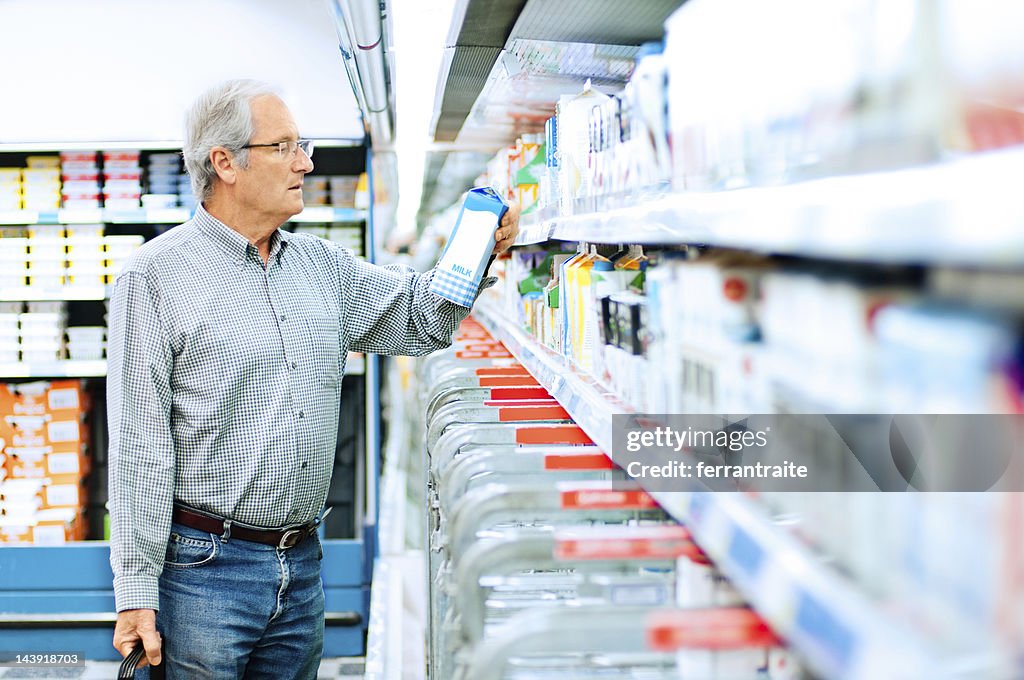 Senior man shopping in supermarket