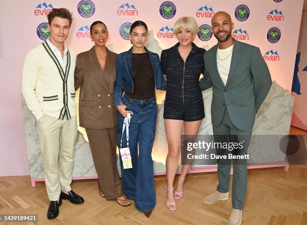 Oliver Cheshire, Rochelle Humes, Shanina Shaik, Pixie Lott and Marvin Humes pose in the evian VIP Suite on day one of Wimbledon 2023 on July 3, 2023...