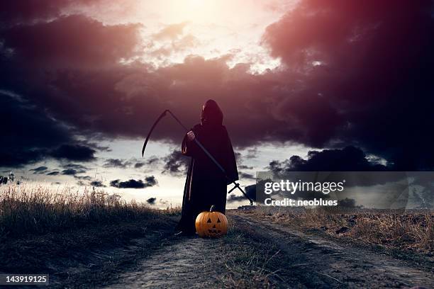 grim reaper and jack o' lantern - halloween 2011 stock pictures, royalty-free photos & images