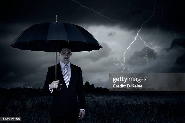 businessman - lightning protection stock pictures, royalty-free photos & images