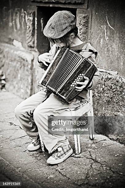 little girl playing accordion - street child stock pictures, royalty-free photos & images