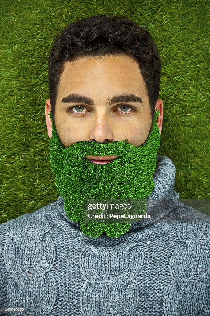 Man with a grass beard thinking green
