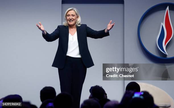 French far-right party Rassemblement National parliamentary group leader Marine Le Pen waves to audience during the Rassemblement National's 18th...