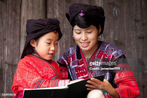 yao ethnic minority mother and daughter - longsheng stock pictures, royalty-free photos & images